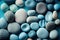 Blue rounded sea pebbles. 3D textured stones ocean bank surface. Summer travel holiday background. Round beach soft