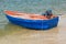 Blue rowboat on the beach