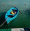 Blue rowboat in the mediterranean Sea