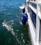 Blue Rubber Fenders on Pontoon Boat on Lake