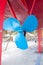 Blue sailboat propeller in a red hull