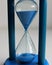 Blue Sand Flows Down In A Colored Sandglass Detailed Stock Photo