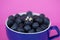 Blue Sapphire And Diamond Gold Ring In A Cup Of Blueberries