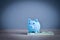 A blue saving  piggy on a dollar bill to show wealth through saving money