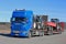 Blue Scania Truck Hauls Agricultural Equipment