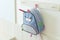 Blue school rucksack hanging on the wall