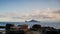 Blue sea and blue sky with changing white clouds. Small islands and rocks.