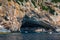 Blue sea and the characteristic caves of Cala Luna, a beach in the Golfo di Orosei, Sardinia, Italy. Big sea caves in the