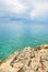 Blue sea and clouds with jagged cliffs