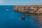 Blue sea lanscape with high stone cliff