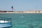 Blue sea and sea view from the deck of a white yacht. Egypt Hurghada. Boats, ships anchored off the coast. Summer and relaxation