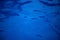 Blue sea water surface. Swimming pool water texture. Blue liquid reflections photo wallpaper.