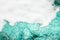 Blue sea water white foam texture background closeup, foamy ocean wave pattern, aqua bubbles surface, swimming pool backdrop