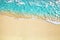 Blue sea wave, white foam, golden sand beach, turquoise ocean water close up, summer holidays border frame concept, copy space