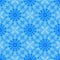 Blue seamless fractal based tile with a circular flower or mandala design