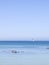 Blue seascape with sailboat on the horizon