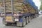 Blue semi-trailer with eucalyptus timber on trailer