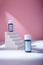 Blue serum or acid mock up bottles with blank label, no brand template on white concrete stairs, pink backdrop. Cosmetics hair