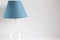 Blue shade table lamp with glass element. Trendy color in your interior