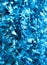 Blue shiny plastic ribbon tassel background