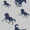 Blue silhouettes of sports horses isolated on a  colored background