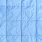 Blue silk quilted fabric as a background