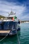 Blue and silver motor yacht in the port of Portovenere Liguria Italy