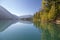 Blue skies, mountains and shoreline reflect perfectly, Birkenhead Lake Park near Pemberton and Whistler, Canada