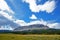 Blue skies over a mountaintop in Glacier.