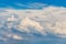 Blue sky with altocumulus white curly clouds_