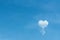 Blue sky background and single white clouds in heart shaped balloon patterns concept floating , copy space