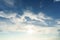 Blue sky background. Summer sky is bright blue. There are clouds floating through. Feel relax when looking. See the sun on the sun