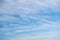 Blue sky background with tiny clouds, cirrus