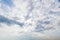 Blue sky background with white clouds cumulus floating soft focus