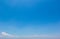 Blue sky background with white clouds cumulus floating soft focus, copy space