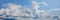 Blue sky background with white tiny clouds. Sky panorama.