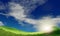 Blue sky and beautiful cloud with meadow and sunshine. Plain landscape background for summer poster. The best view for holiday.