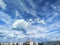 Blue sky with beautiful clouds over urban high-rise buildings