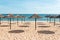 Blue sky, blue sea and parasols at beach in Portugal