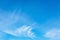 Blue sky with cirrus clouds. Thin, wispy strands of atmospheric clouds. Gentle sky background