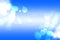 Blue sky with cloud background. Abstract realistic blue sky with delicate fluffy clouds, stars and romantic glamourous sun flair