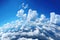 Blue sky and clouds, aerial view of planet Earth curvature, sunny day