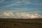 Blue sky with clouds and agricultural ground