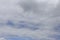 Blue sky with clouds. Background of white and gray clouds