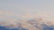 Blue sky with clouds, cirrocumulus clouds at sunrise. Time lapse.