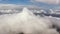 Blue sky with clouds over mountains.