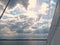 Blue sky with clouds over polish Mazury lakes in summer - view from boat deck in black and white