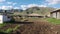 Blue sky with clouds over rural buildings