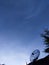 Blue sky and clouds over the satellite dish