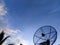 Blue sky and clouds over the satellite dish